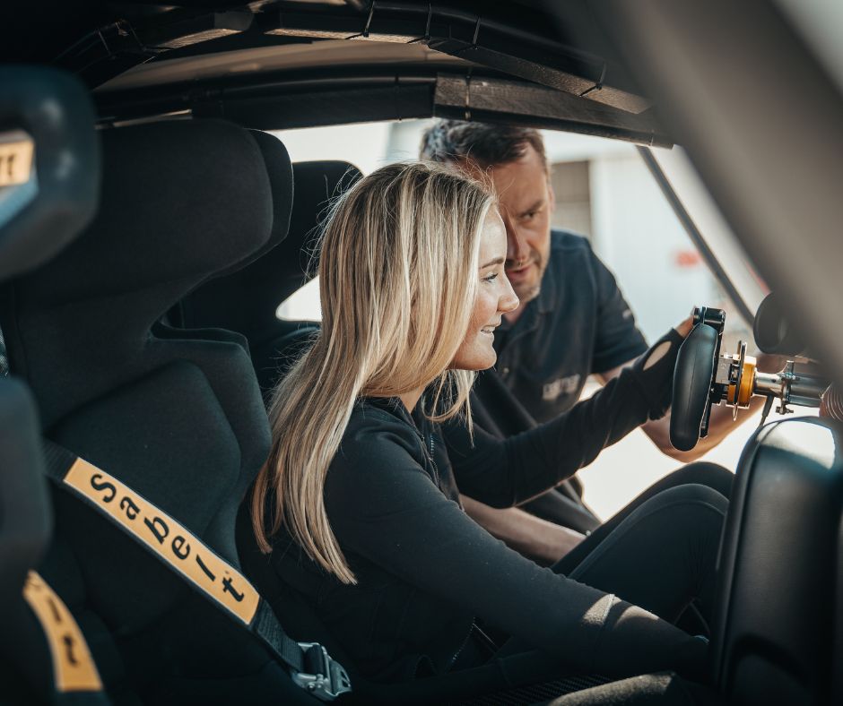 lady with instructor in a racecar