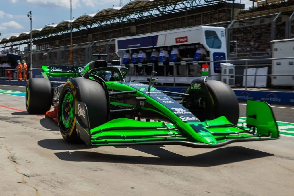 Green Kick Sauber Formula 1 car in the pit lane at the Hungaroring.