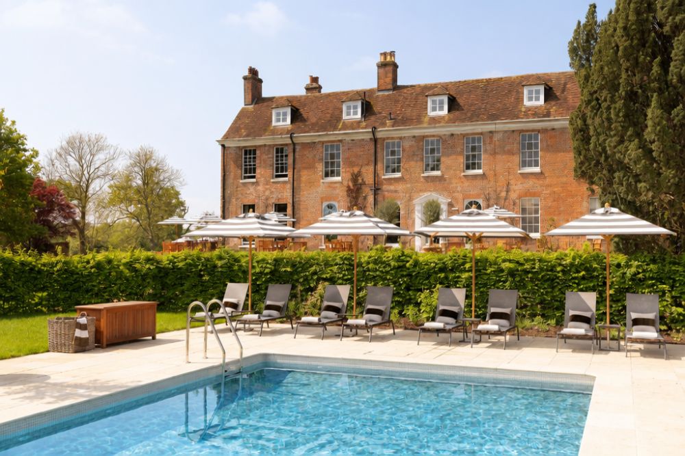 Outdoor pool and gardens at New Park Manor