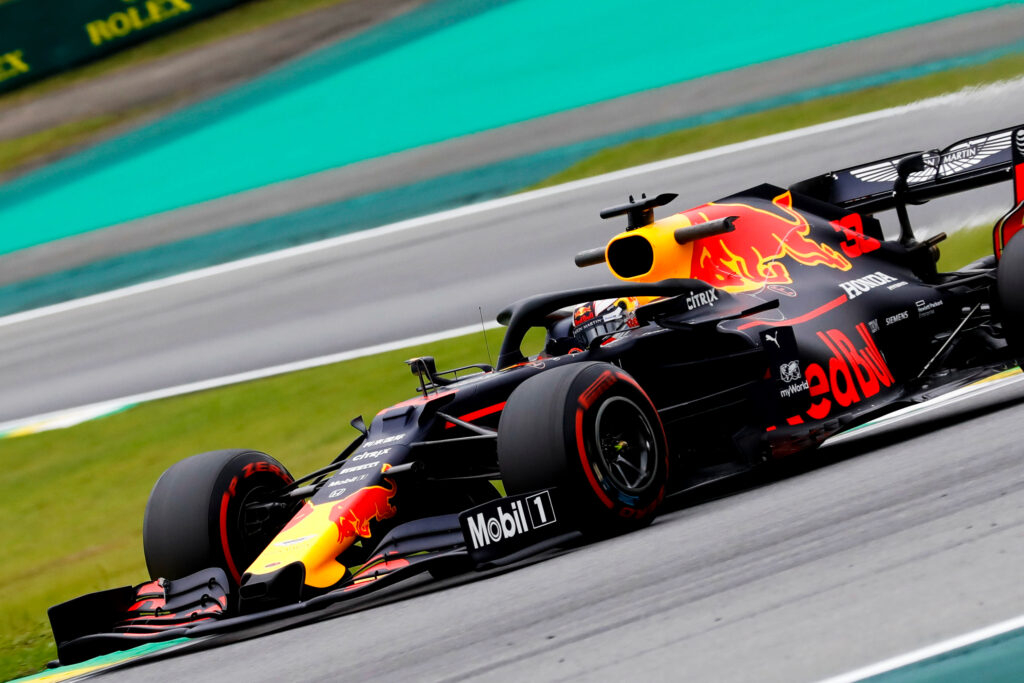 Close-up of a Red Bull Formula 1 car taking a corner at the São Paulo Grand Prix.