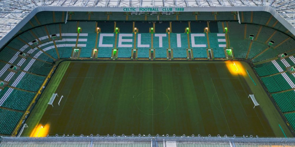 Aerial view of Celtic Park showing pitch and stands.